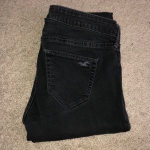 Black Faded washed jeans with rips in the knees